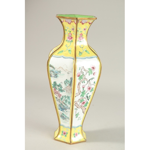 286 - A CHINESE CANTON YELLOW GROUND ENAMELLED HEXAGONAL VASE, 33cm high.