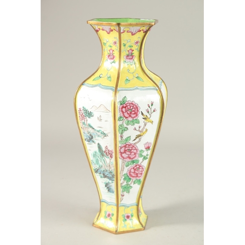 286 - A CHINESE CANTON YELLOW GROUND ENAMELLED HEXAGONAL VASE, 33cm high.