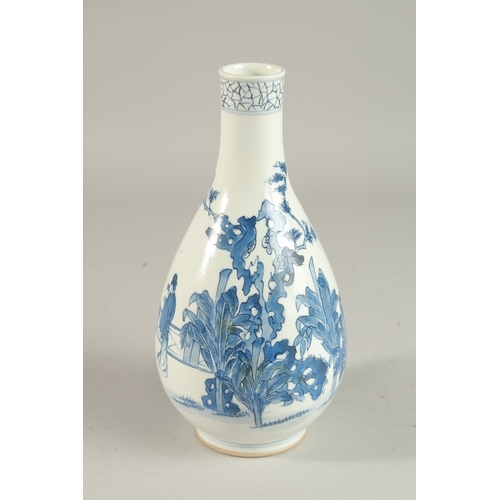 298 - A CHINESE BLUE AND WHITE PORCELAIN BOTTLE VASE, painted with figures, 24cm high.