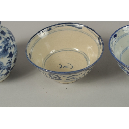 3 - THREE CHINESE BLUE AND WHITE BOWLS, together with a pair of gourd vases -one with missing lid, (af).