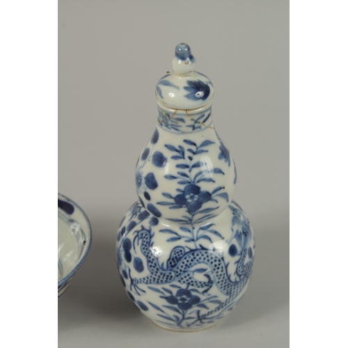 3 - THREE CHINESE BLUE AND WHITE BOWLS, together with a pair of gourd vases -one with missing lid, (af).