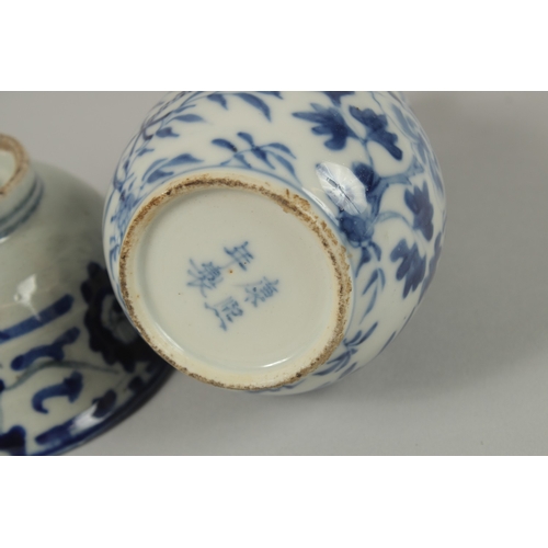 3 - THREE CHINESE BLUE AND WHITE BOWLS, together with a pair of gourd vases -one with missing lid, (af).