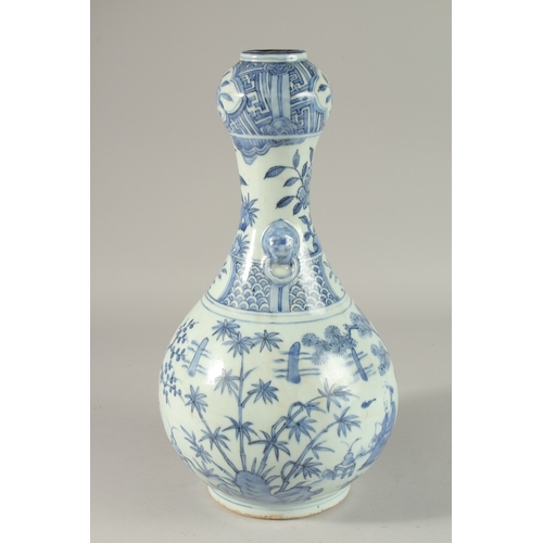 304 - A CHINESE BLUE AND WHITE PORCELAIN GARLIC HEAD VASE, painted with seated figures, 36cm high.