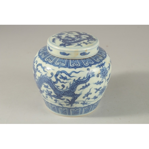 305 - A CHINESE BLUE AND WHITE PORCELAIN DRAGON JAR AND COVER, 12cm high.