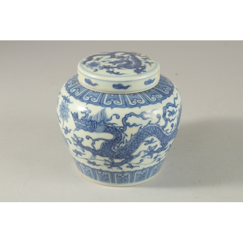 305 - A CHINESE BLUE AND WHITE PORCELAIN DRAGON JAR AND COVER, 12cm high.