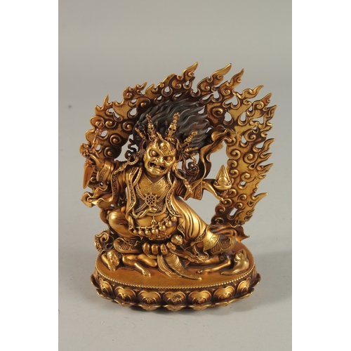 308 - A FINE TIBETAN GILDED ALLOY DEITY, with flaming halo, 18cm high.