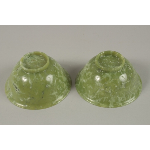 31 - A PAIR OF CHINESE JADE BOWLS, 13cm diameter.