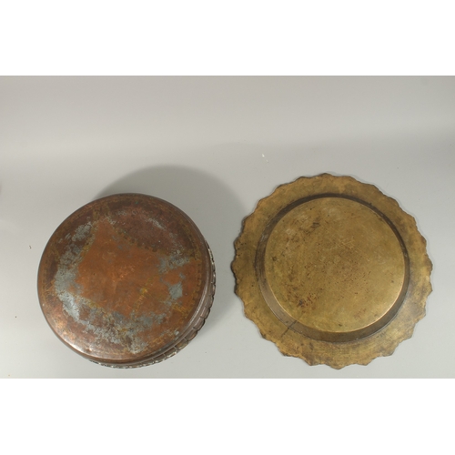 319 - A LARGE PERSIAN ENGRAVED COPPER BOWL, 41.5cm diameter, together with a Tibetan brass tray, (2).