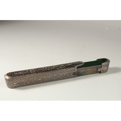 320 - AN ISLAMIC OPENWORK STEEL PEN BOX, the top with silvered calligraphy inscription, 23cm long.