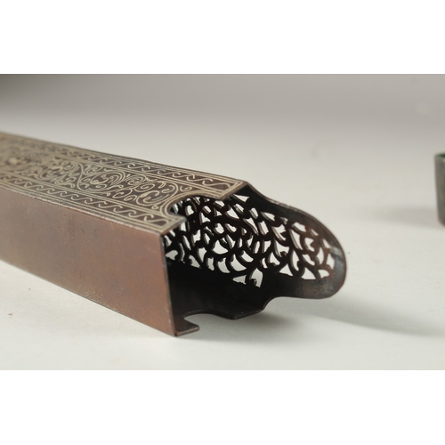 320 - AN ISLAMIC OPENWORK STEEL PEN BOX, the top with silvered calligraphy inscription, 23cm long.