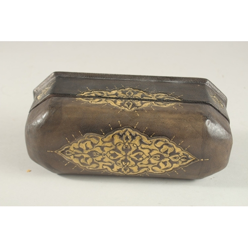 322 - A TURKISH LEATHER OVERLAID WOODEN PEN BOX, 22.5cm long.