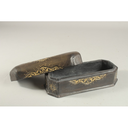 322 - A TURKISH LEATHER OVERLAID WOODEN PEN BOX, 22.5cm long.