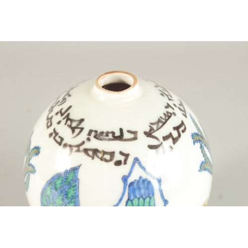 323 - A TURKISH ARMENIAN GLAZED POTTERY BALL ORNAMENT, 20cm high.