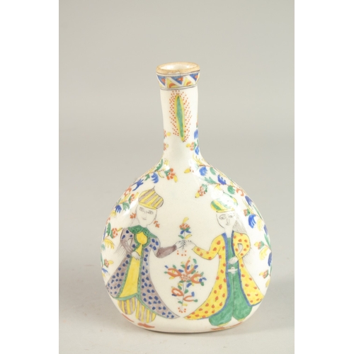 325 - A TURKISH KUTAHYA GLAZED POTTERY BOTTLE, painted with figures, 22cm high.