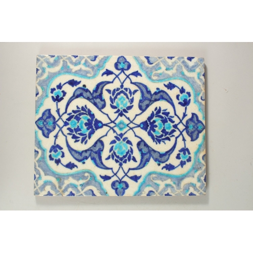 330 - A LARGE TURKISH IZNIK GLAZED POTTERY TILE, 32.5cm x 26.5cm.