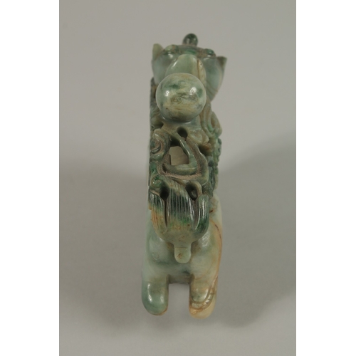 34 - A CHINESE CARVED JADE FIGURE OF A BULL, 13cm long.