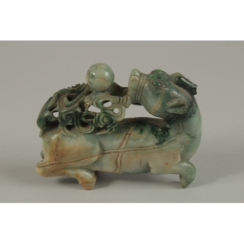 34 - A CHINESE CARVED JADE FIGURE OF A BULL, 13cm long.