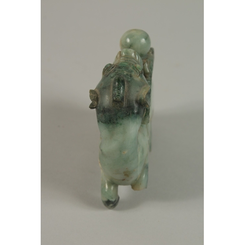 34 - A CHINESE CARVED JADE FIGURE OF A BULL, 13cm long.