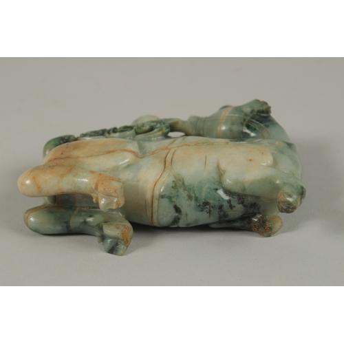 34 - A CHINESE CARVED JADE FIGURE OF A BULL, 13cm long.