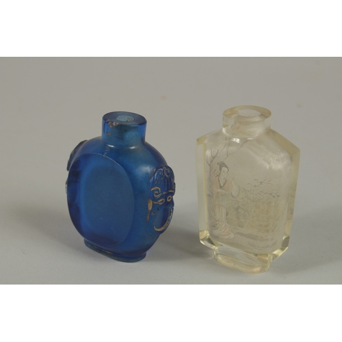 45 - A CHINESE REVERSE GLASS PAINTED SNUFF BOTTLE, together with a blue glass bottle, (2).