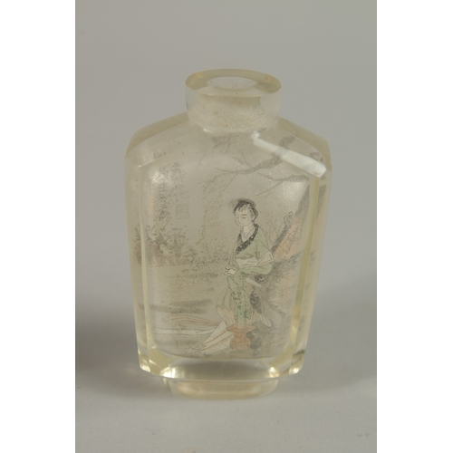 45 - A CHINESE REVERSE GLASS PAINTED SNUFF BOTTLE, together with a blue glass bottle, (2).