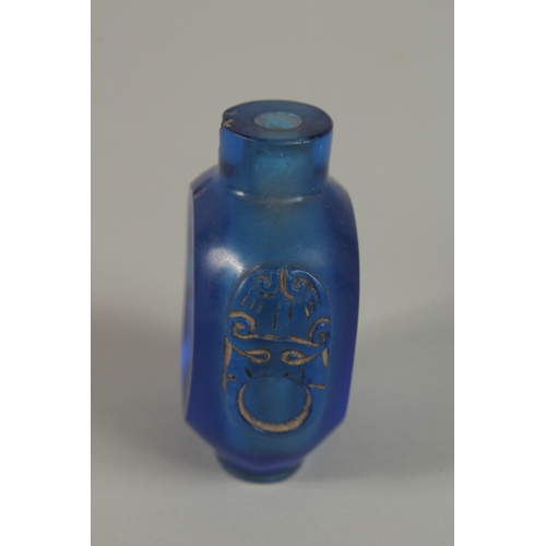 45 - A CHINESE REVERSE GLASS PAINTED SNUFF BOTTLE, together with a blue glass bottle, (2).