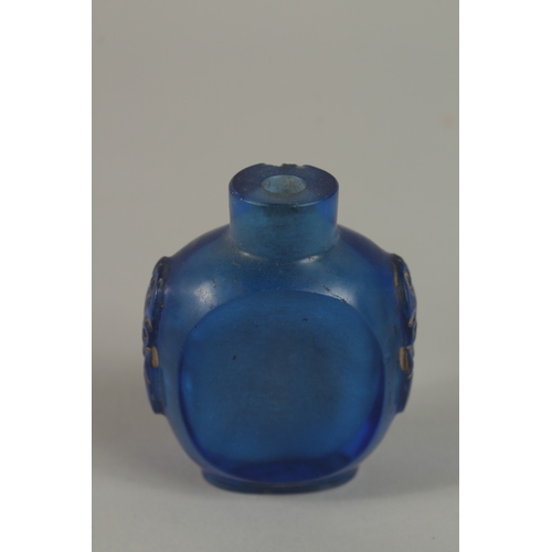 45 - A CHINESE REVERSE GLASS PAINTED SNUFF BOTTLE, together with a blue glass bottle, (2).