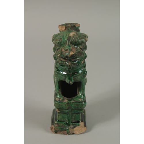 50 - A CHINESE GREEN GLAZED POTTERY LION DOG, 17cm high.