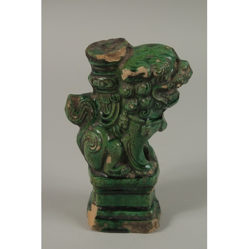 50 - A CHINESE GREEN GLAZED POTTERY LION DOG, 17cm high.