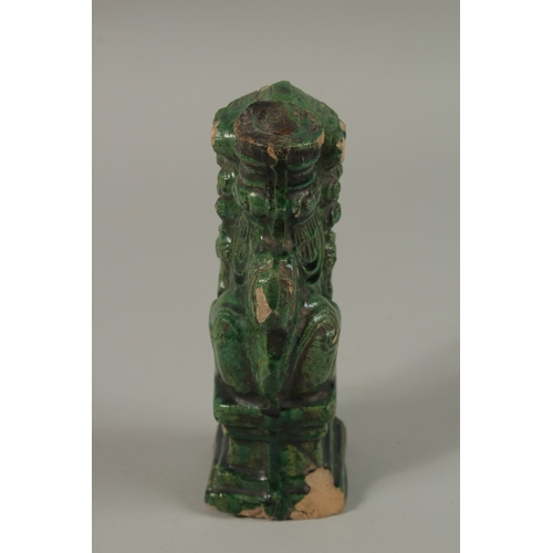 50 - A CHINESE GREEN GLAZED POTTERY LION DOG, 17cm high.