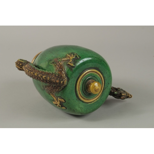 52 - A FINE CHINESE GREEN AND YELLOW GLAZED TEAPOT OR WATER DROPPER, with dragon formed handle and spout,... 