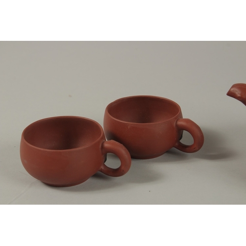 53 - A CHINESE YIXING TEA SET, comprising a teapot and four tea cups (one broken), each piece with impres... 