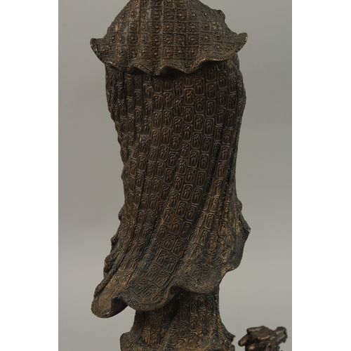 56 - A FINE AND LARGE CHINESE BRONZE FIGURE OF GUANYIN, stood upon a mythical turtle on a circular lotus ... 