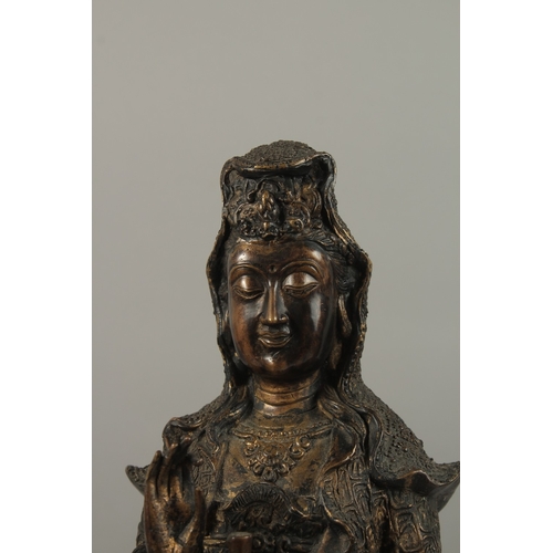 56 - A FINE AND LARGE CHINESE BRONZE FIGURE OF GUANYIN, stood upon a mythical turtle on a circular lotus ... 