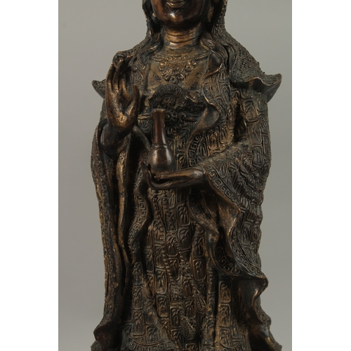 56 - A FINE AND LARGE CHINESE BRONZE FIGURE OF GUANYIN, stood upon a mythical turtle on a circular lotus ... 