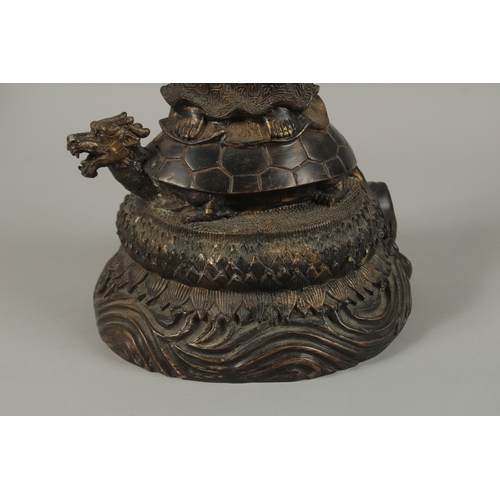 56 - A FINE AND LARGE CHINESE BRONZE FIGURE OF GUANYIN, stood upon a mythical turtle on a circular lotus ... 