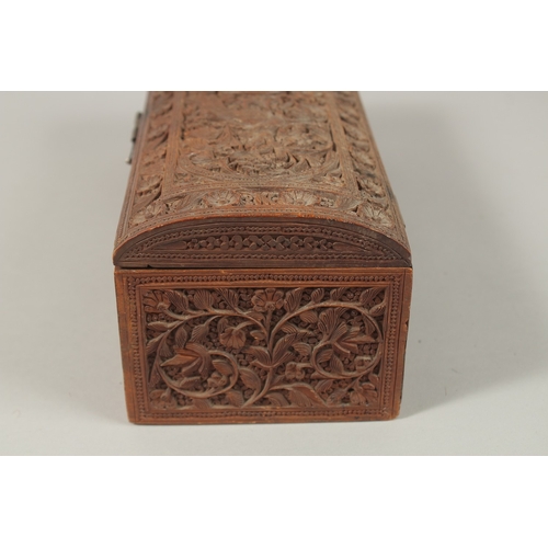 62 - A VERY FINE THAI OR INDIAN CARVED WOOD RECTANGULAR BOX, with mythical creatures and fine foliate car... 