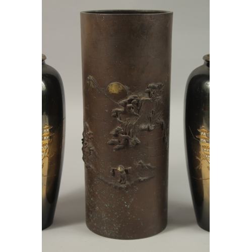 64 - A PAIR OF JAPANESE MIXED METAL VASES, 24cm high, together with a cylindrical vase with relief decora... 