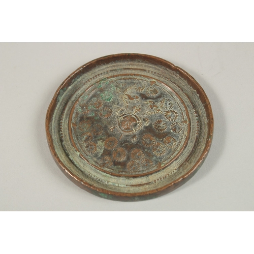 68 - A CHINESE CIRCULAR BRONZE MIRROR, 8.5cm diameter.