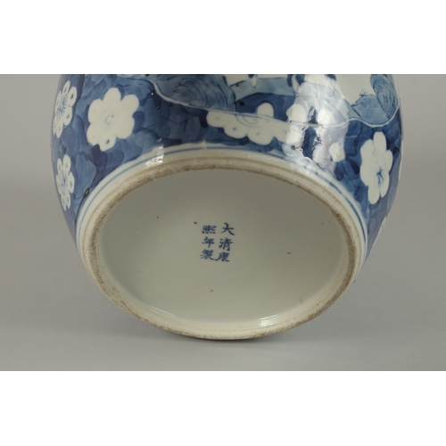 7 - A CHINESE BLUE AND WHITE PORCELAIN GINGER JAR AND COVER, the base with six-character mark, 28cm high... 