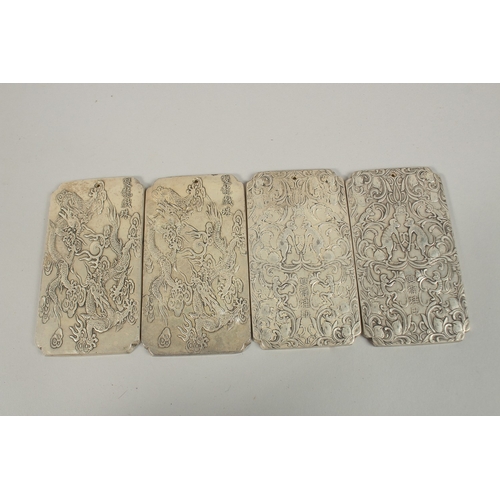 70 - FOUR CHINESE WHITE METAL SCROLL WEIGHTS, each with stamped mark to reverse, (4).