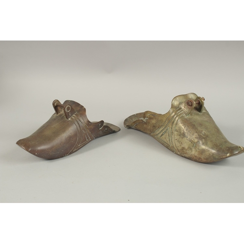 71 - TWO CHINESE BRASS SHOE SHAPED STIRRUPS, (2).