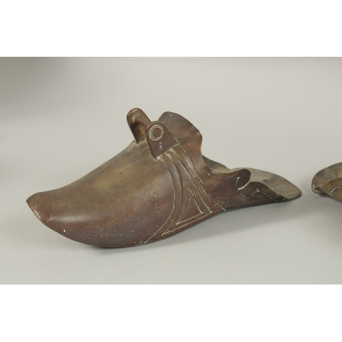 71 - TWO CHINESE BRASS SHOE SHAPED STIRRUPS, (2).