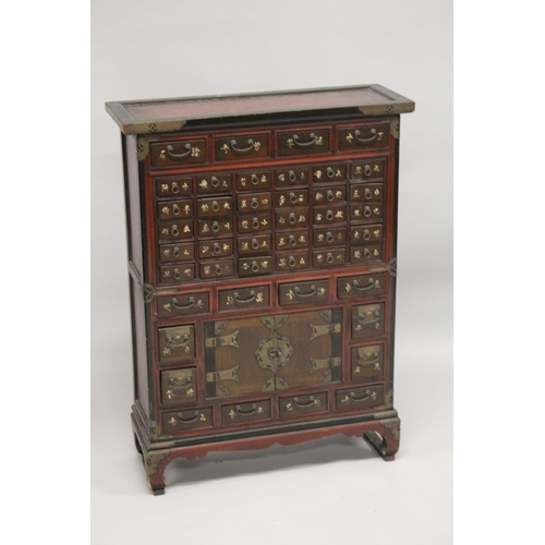 91 - A CHINESE WOODEN SPECIMEN CABINET, comprising 46 drawers and a pair of doors, raised on four feet, 9... 