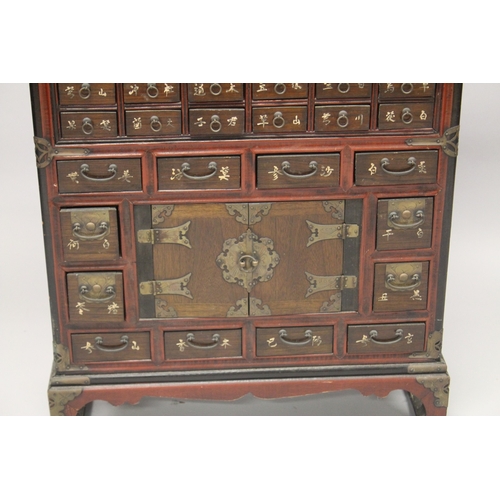 91 - A CHINESE WOODEN SPECIMEN CABINET, comprising 46 drawers and a pair of doors, raised on four feet, 9... 