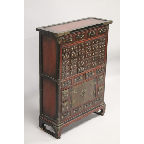 91 - A CHINESE WOODEN SPECIMEN CABINET, comprising 46 drawers and a pair of doors, raised on four feet, 9... 