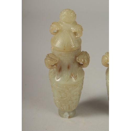 93 - A PAIR OF 18TH CENTURY CARVED JADE VASES AND COVERS, with ram mask handles and carved scrolls, 19cm ... 