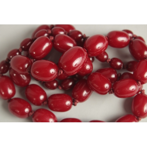 98 - A CHERRY AMBER STYLE BEADED NECKLACE, the beads of graduating sizes.