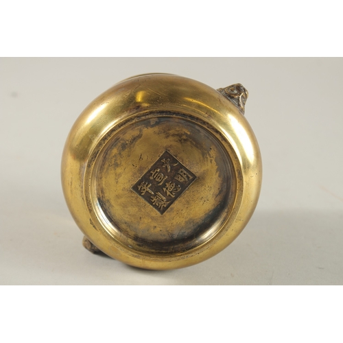 66 - A CHINESE BRONZE OR BRASS TWIN HANDLE CENSER, the base with six-character mark, 7.5cm high.