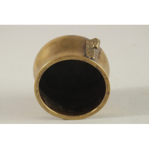 66 - A CHINESE BRONZE OR BRASS TWIN HANDLE CENSER, the base with six-character mark, 7.5cm high.